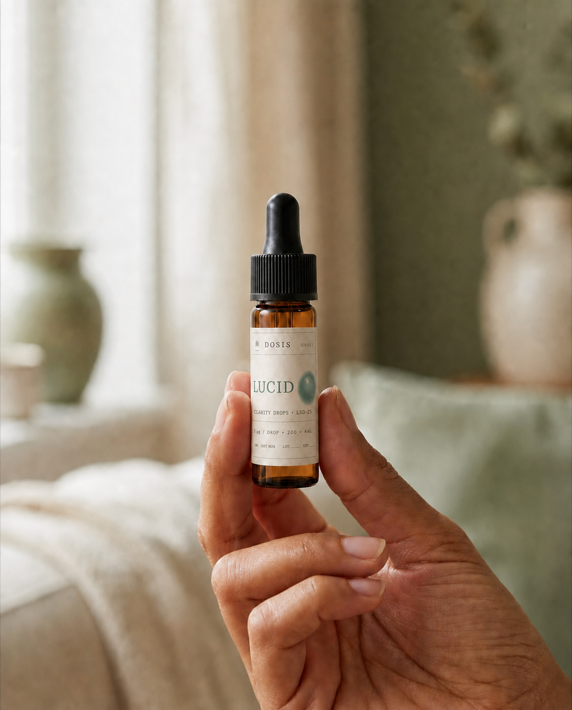 DOSIS — hand with vial editorial